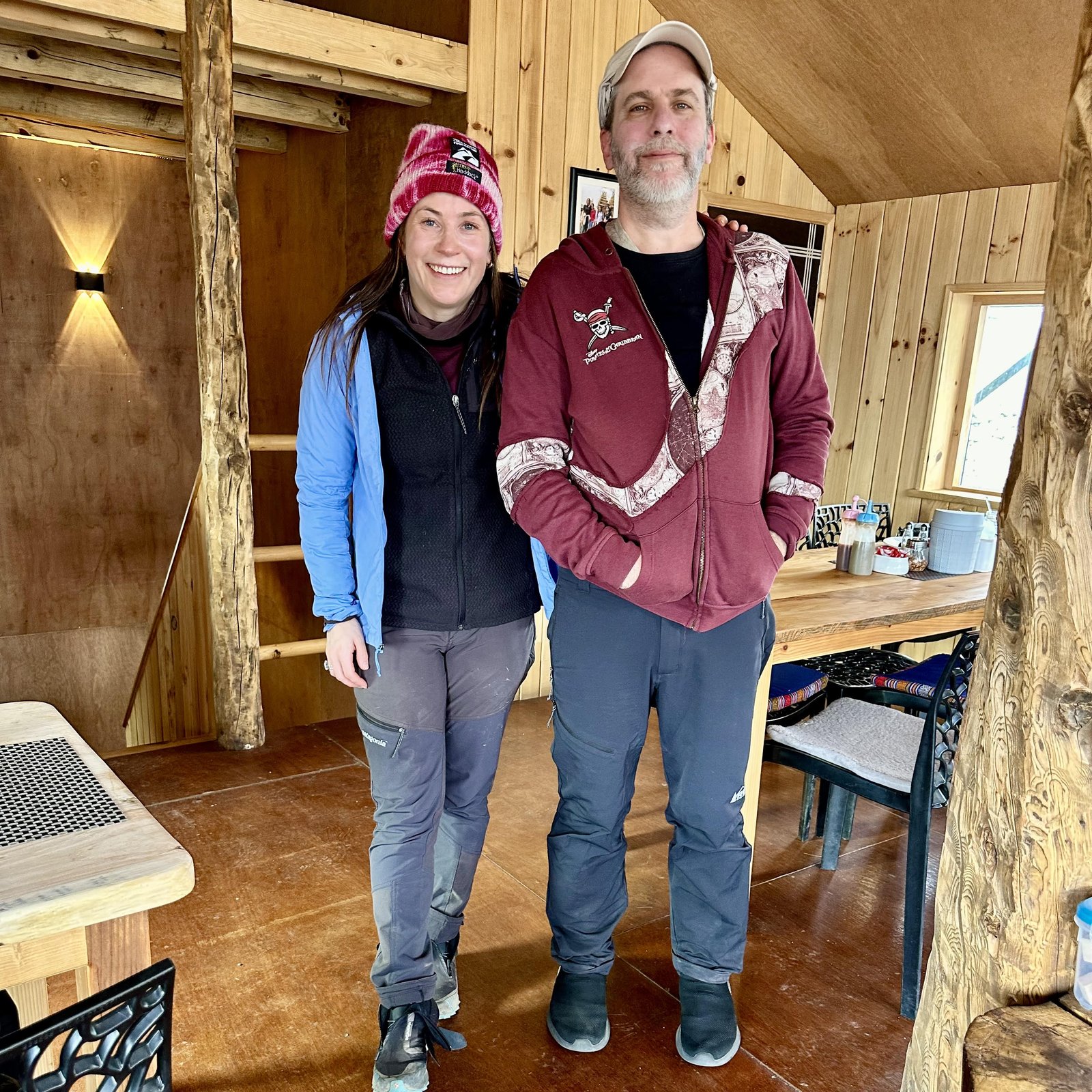 Edward standing next to mountaineer Kristin Harila at a teahouse in Dingboche